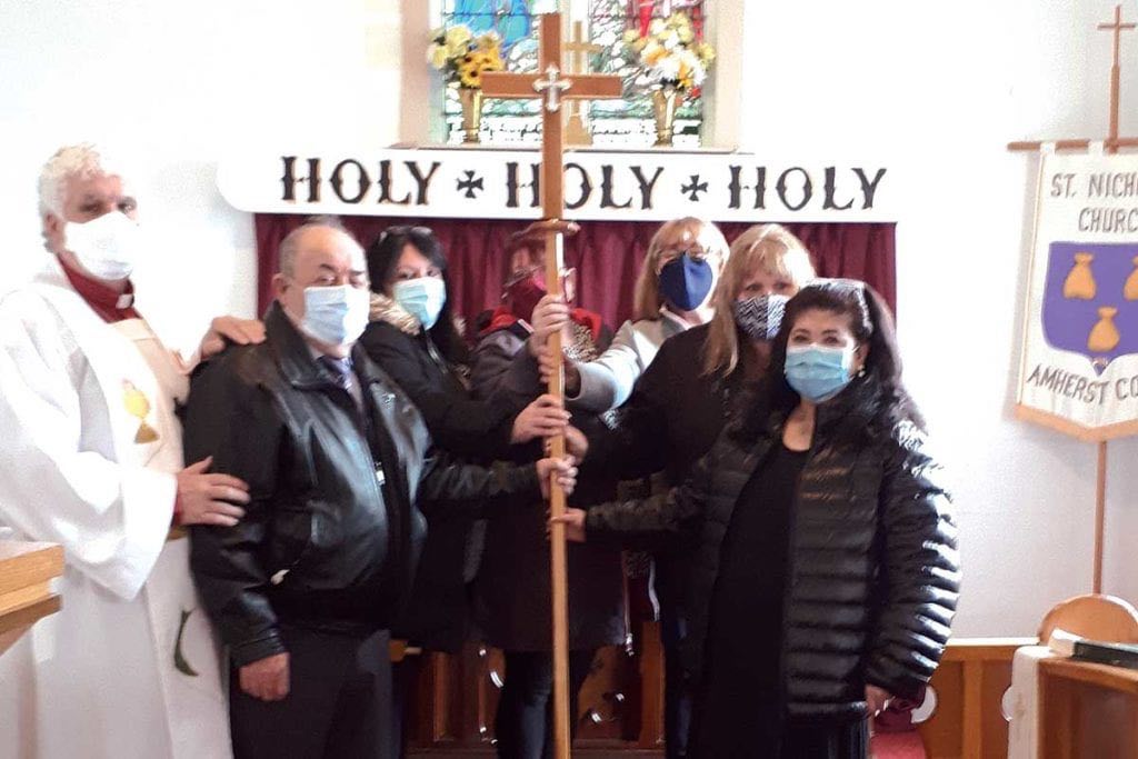 Pictured above are The Rev’d Eli Cross, Harry Wareham, and Estrella Ford (widow of Derrick), along with members of the family