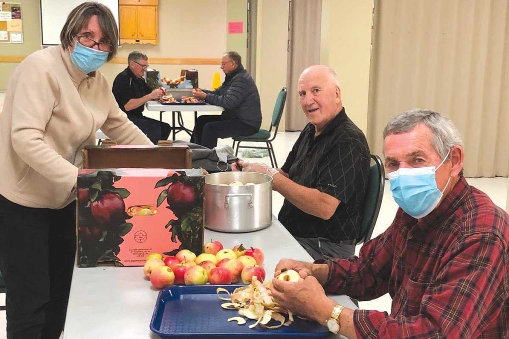 Peeling apples: Sybil Piercey, Lloyd Piercey, and Foster Lamswood