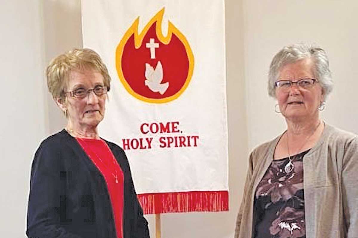 Winnie Munden and Shirley Keeping with the new banner; photo by Shirley Keeping