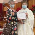 Sheila Tucker receives certificate of appreciation from Rev’d Kay