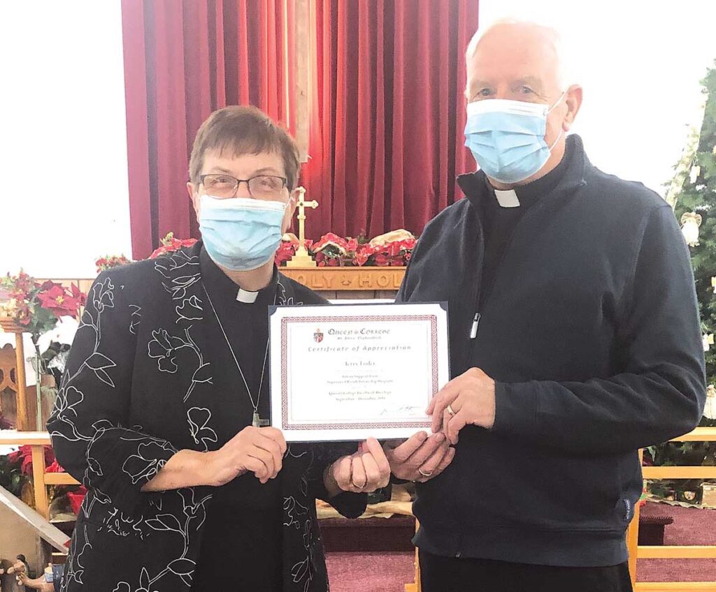 Deacon Terry Loder, the chair of the intern support team, receiving his certificate of appreciation from Rev’d Kay.