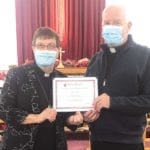 Deacon Terry Loder, the chair of the intern support team, receiving his certificate of appreciation from Rev’d Kay.