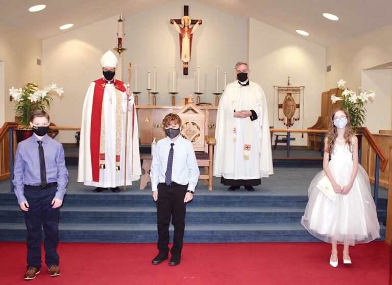 Back row: Bishop Samuel Rose and Fr. Jonathan Rowe Front row: Michael Deir, Andrew Marsh, and Eleanor Murray