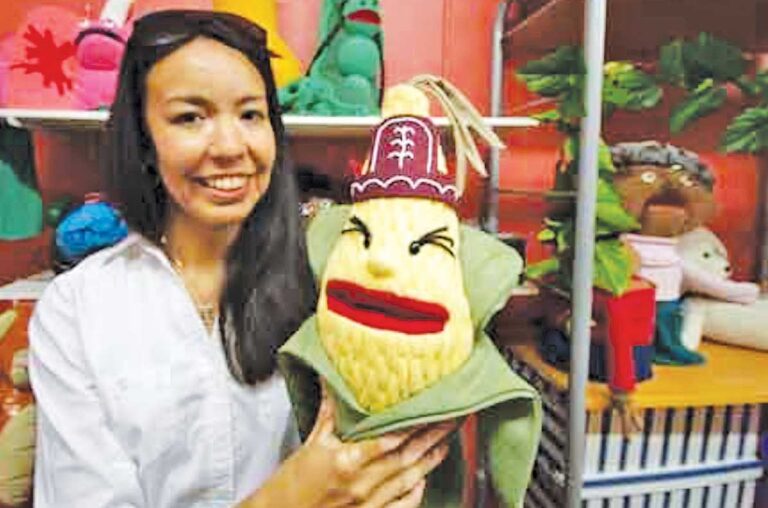 Marion Delaronde with a puppet used to teach and preserve first nations language and culture