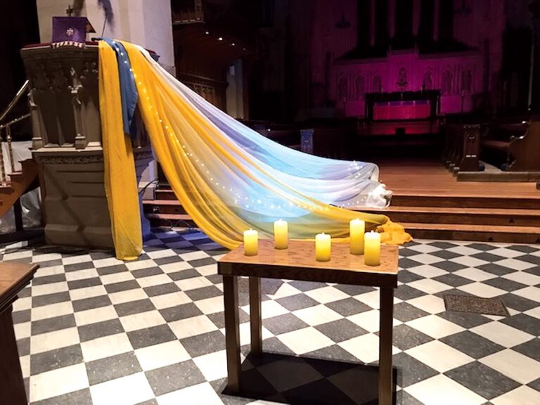 candles lit for vigil in front of the pulpit