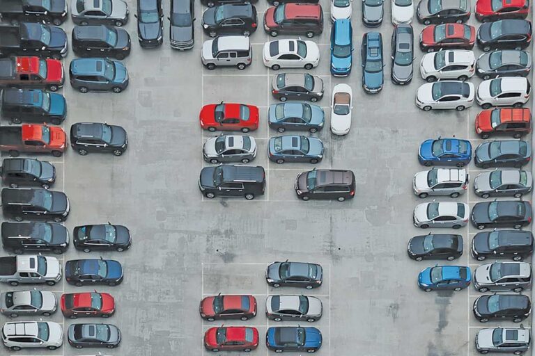 Aerial photo of a parking lot with cars