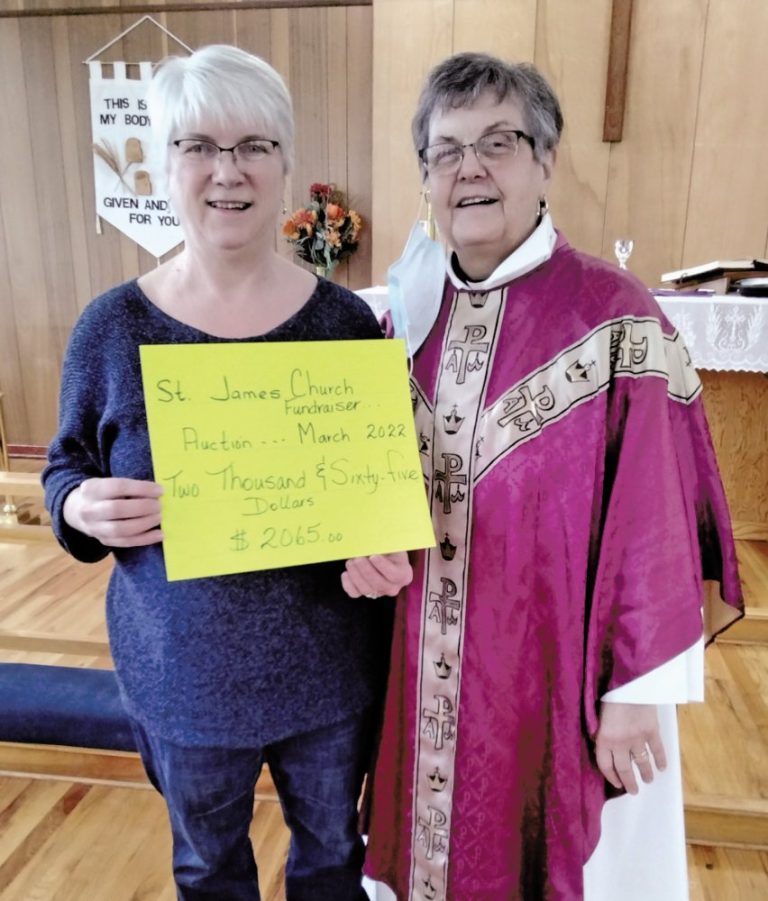 Audrey Park presents cheque to Rev'd Kay