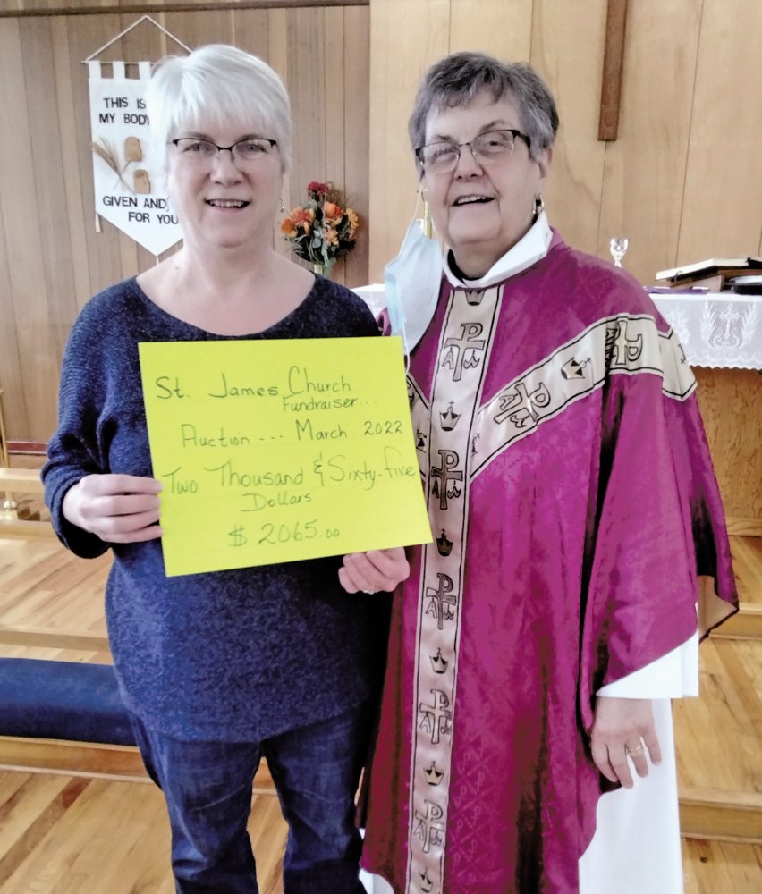 Audrey Park presents cheque to Rev'd Kay