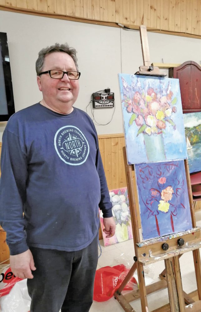 The Rev'd Ed Coleman with the painting for the event