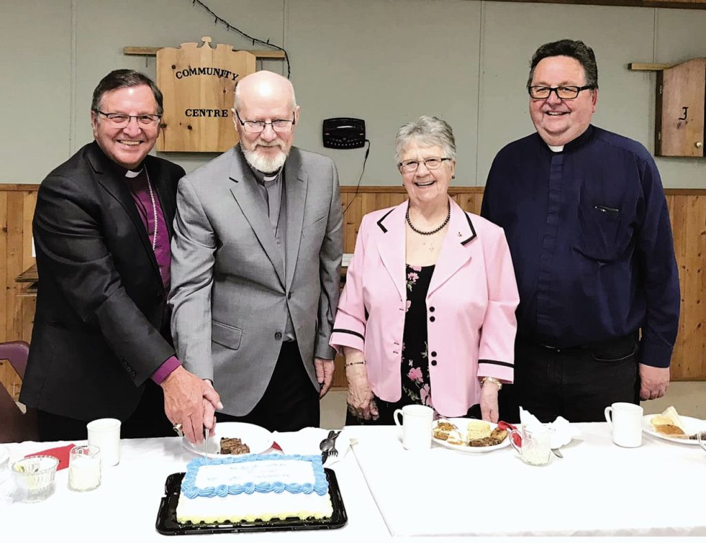cutting the ordination cake for Herb Park