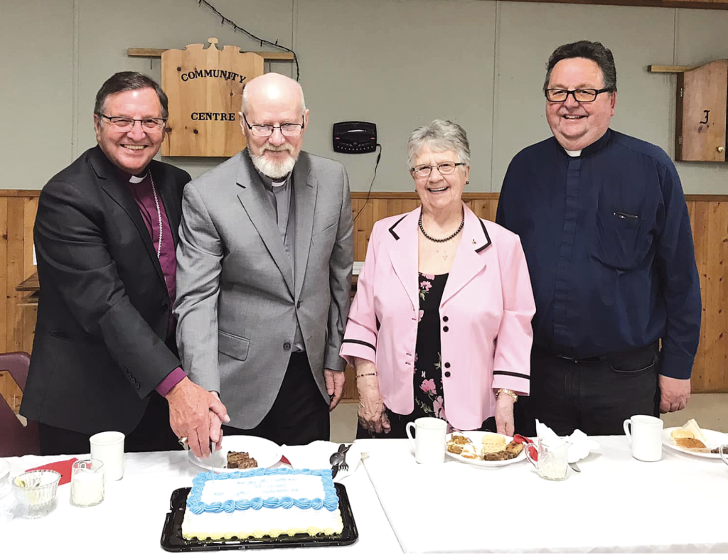 cutting the ordination cake for Herb Park