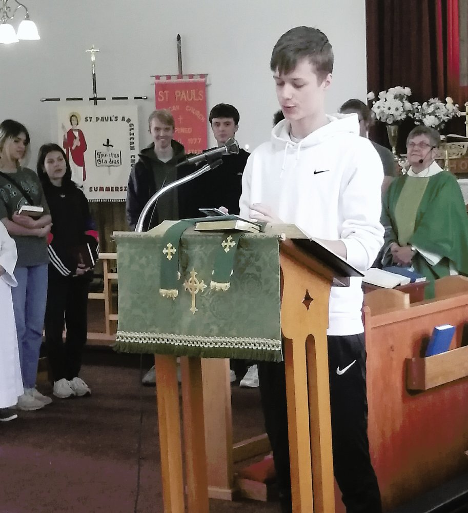 international student reading in church