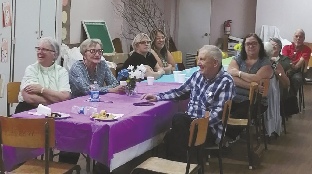 people gathered at a farewell dinner