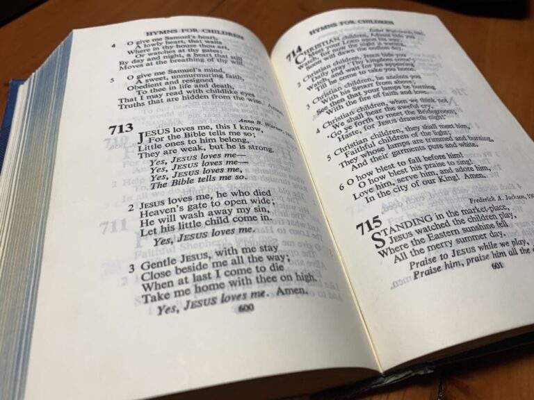 The Book of Common Praise, open to the hymn Jesus Loves Me
