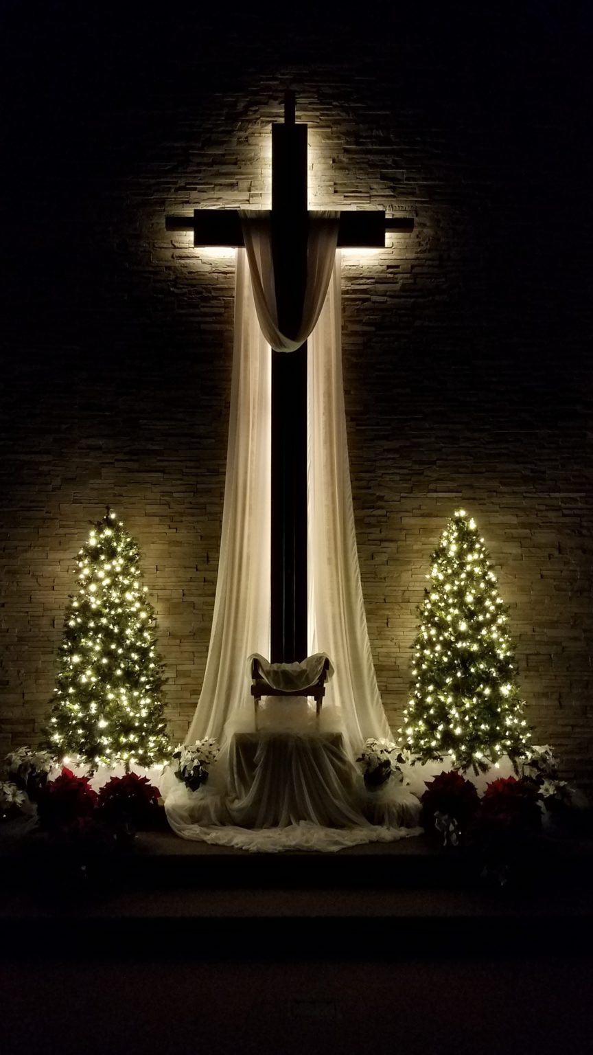 manger and illuminated cross