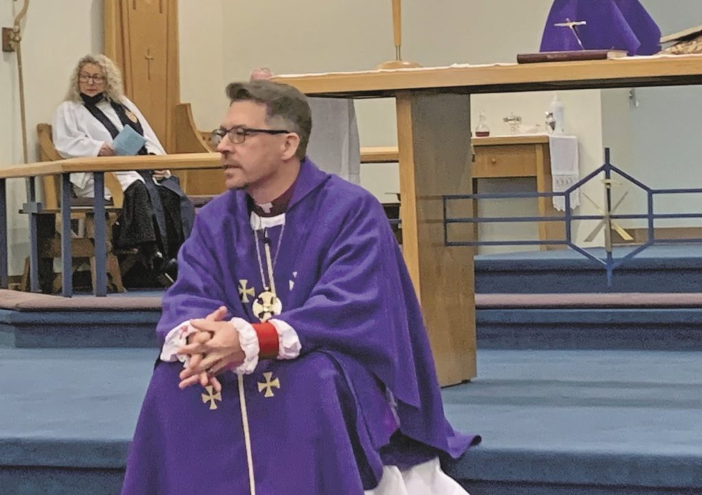 Bishop Sam Rose on the steps