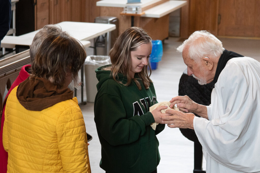 Man blesses pet in the Anglican Cathedral of St. John the Baptist, St. John's, Newfoundland.
