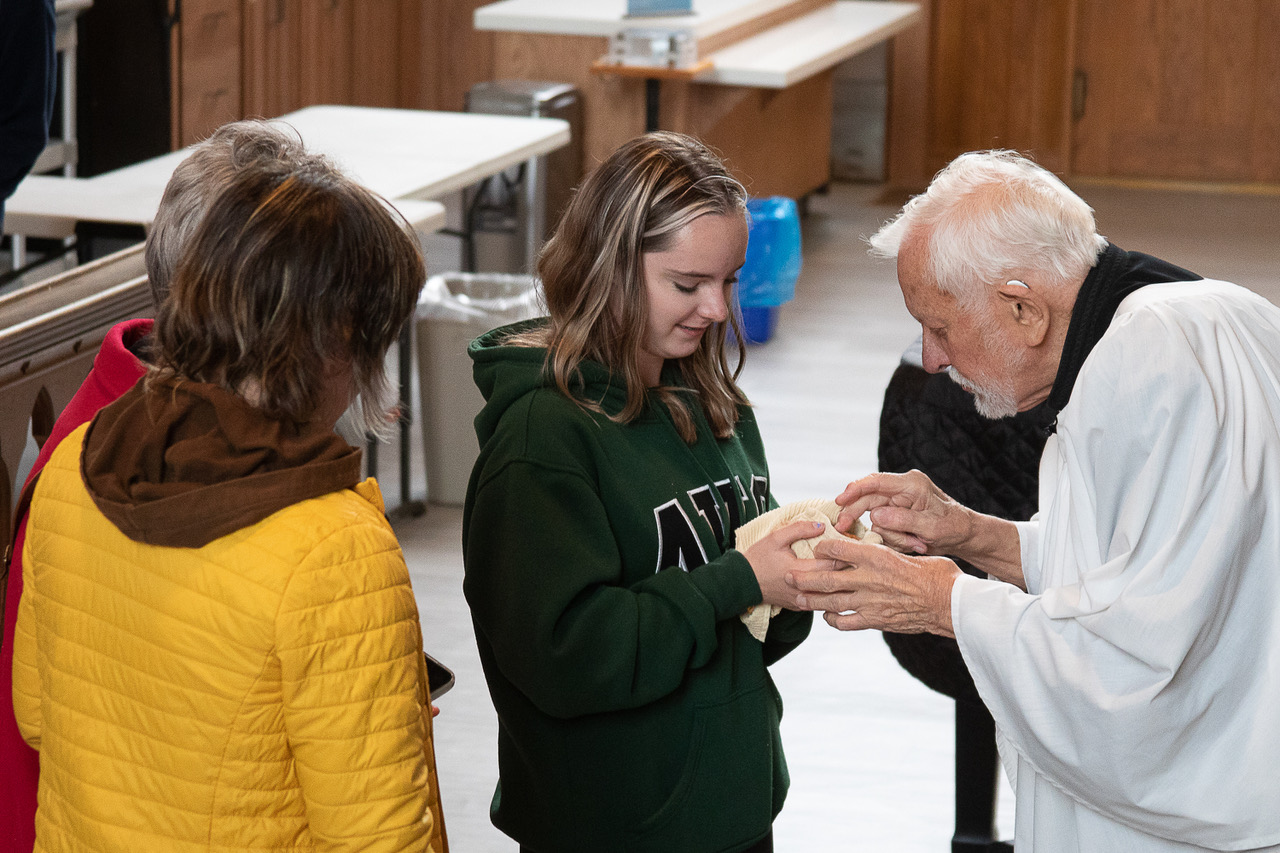 Man blesses pet in the Anglican Cathedral of St. John the Baptist, St. John's, Newfoundland.