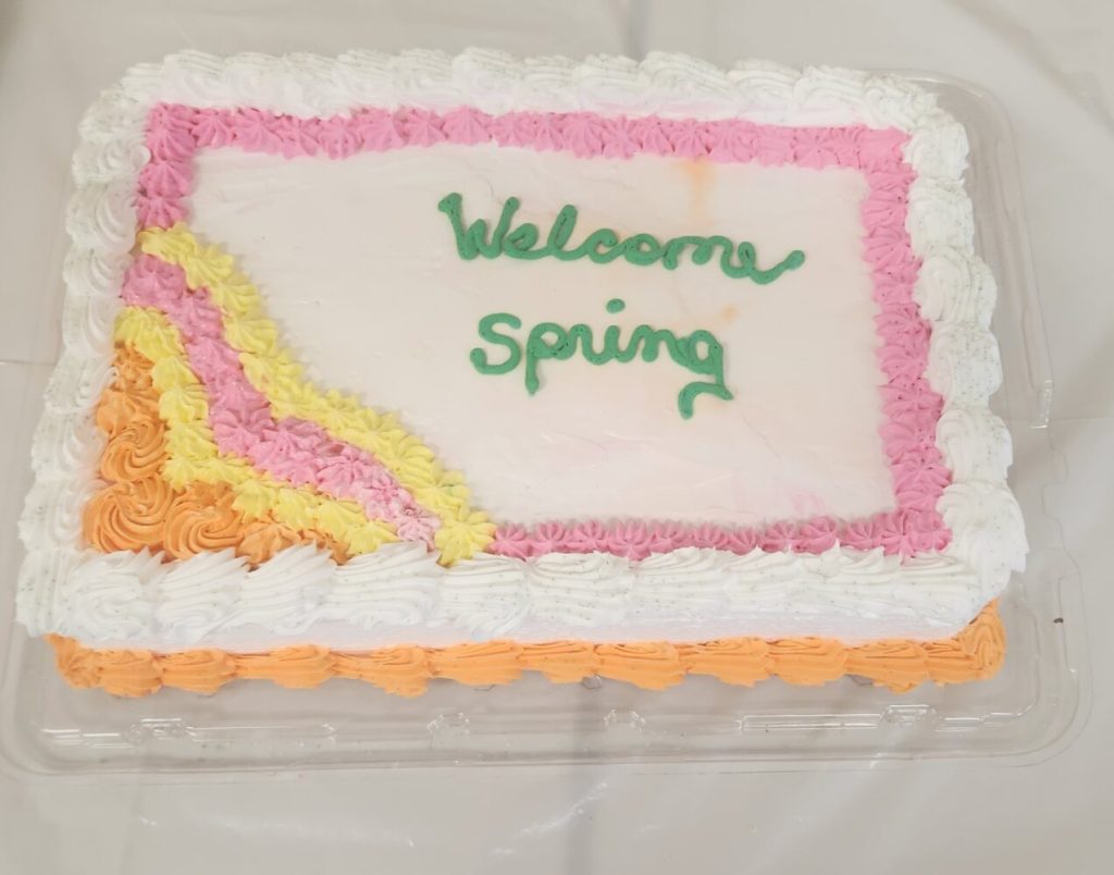 cake that says welcome spring on it.