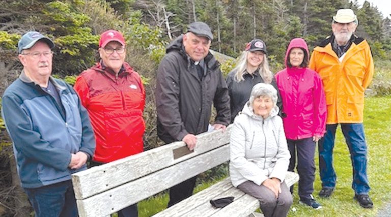 people enjoying a break while on a prayer walk in Upper Gullies, Newfoundland.