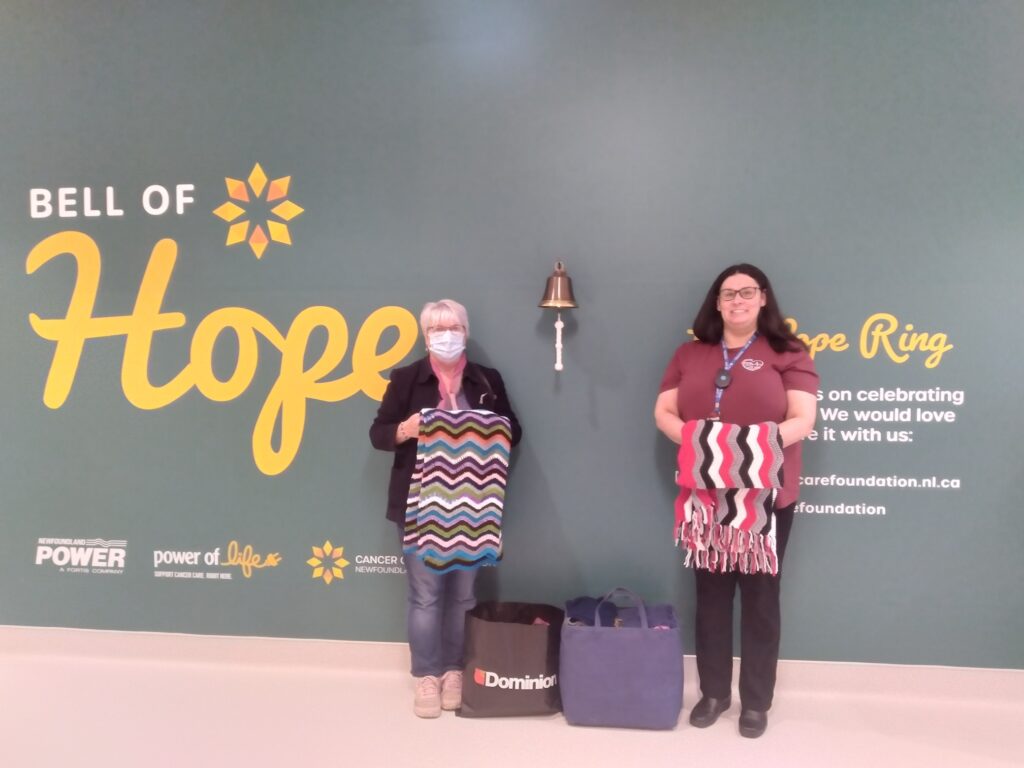 two women in the cancer unit in Corner Brook Newfoundland with home made shawls for the patients