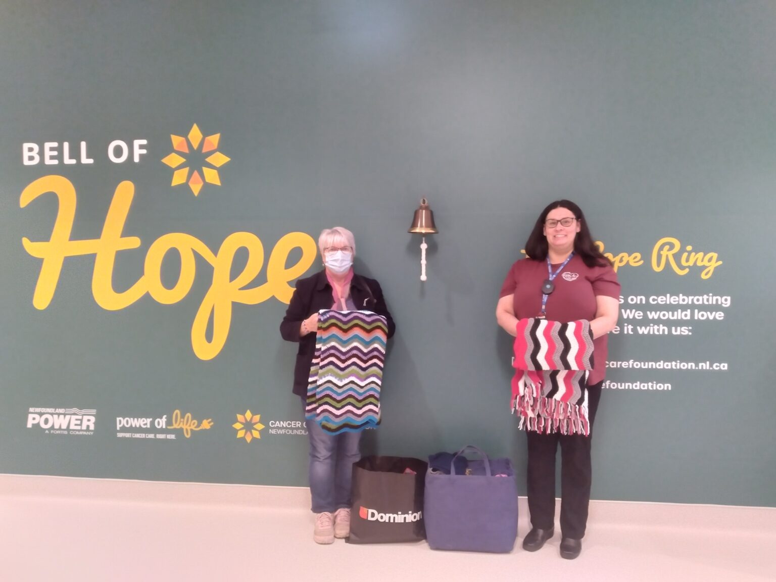 two women in the cancer unit in Corner Brook Newfoundland with home made shawls for the patients
