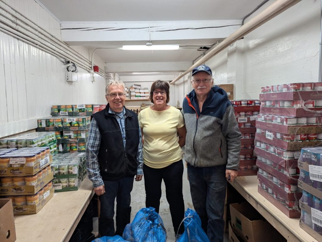 three people at a local food bank
