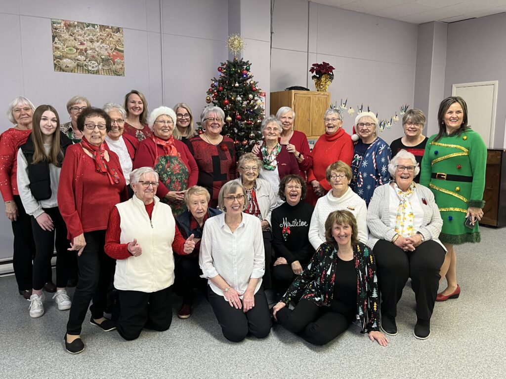 ladies from the ACE gather to celebrate a tea that they held for the local community in the lead up to Christmas