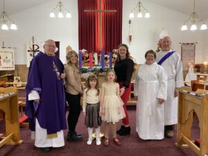 A family lighting the advent wreath in St. Paul's Summerside