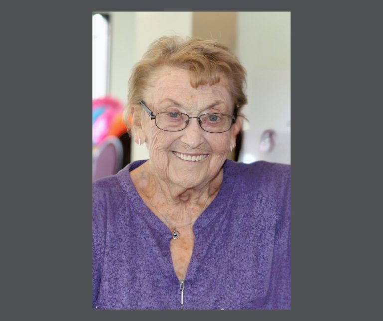 photograph of an oder woman, smiling