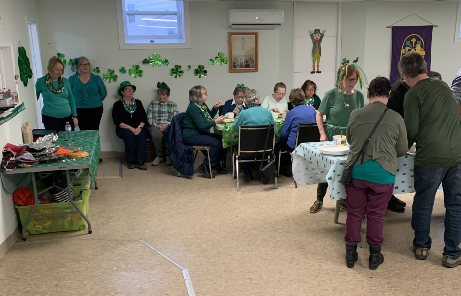 People at a church potluck for St. Patrick's Day, 2025