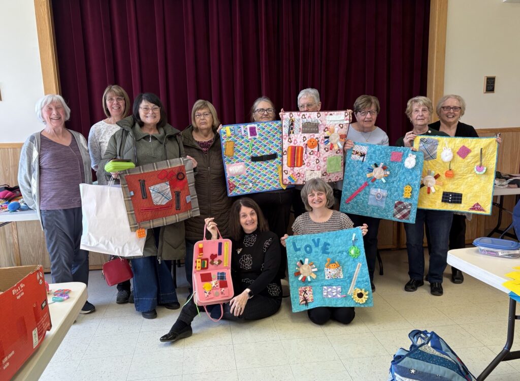 group of crafters who came together to make fidget mats for people with Alzheimer’s or dementia