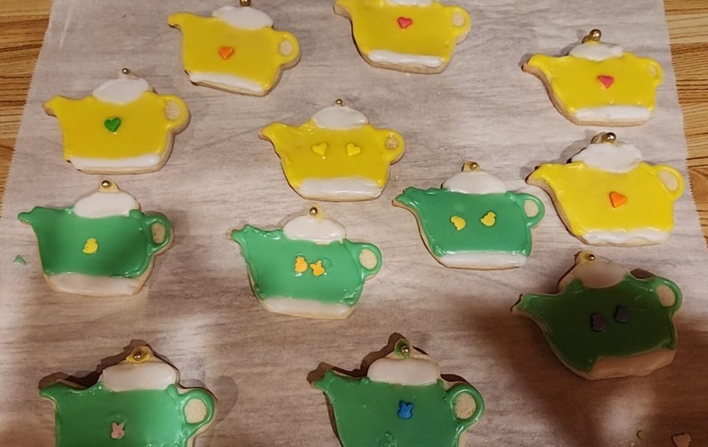 cookies on a table, decorated to look like teapots