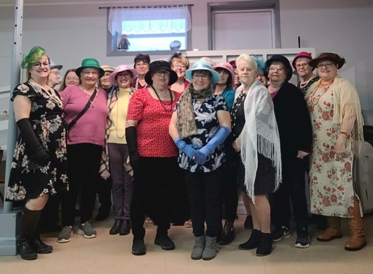 group of people wearing hats and other fancy clothing