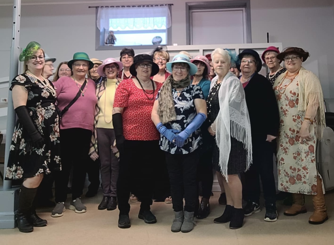 group of people wearing hats and other fancy clothing