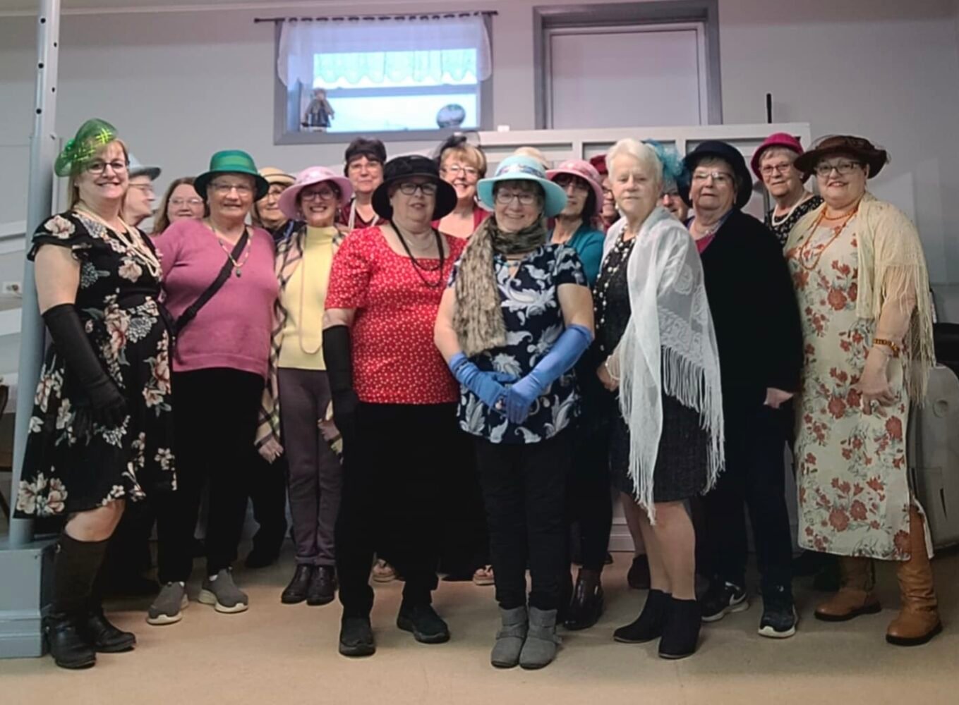 group of people wearing hats and other fancy clothing