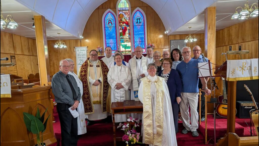 A group of people standing inside a church.