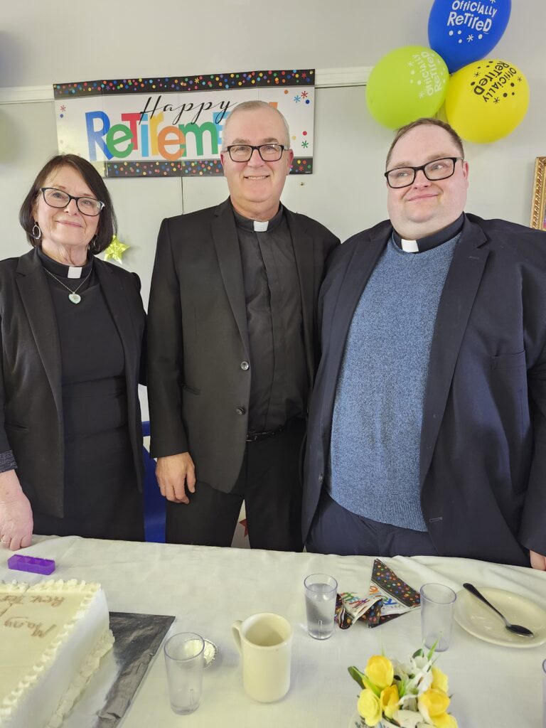 three people dressed as Anglican clergy