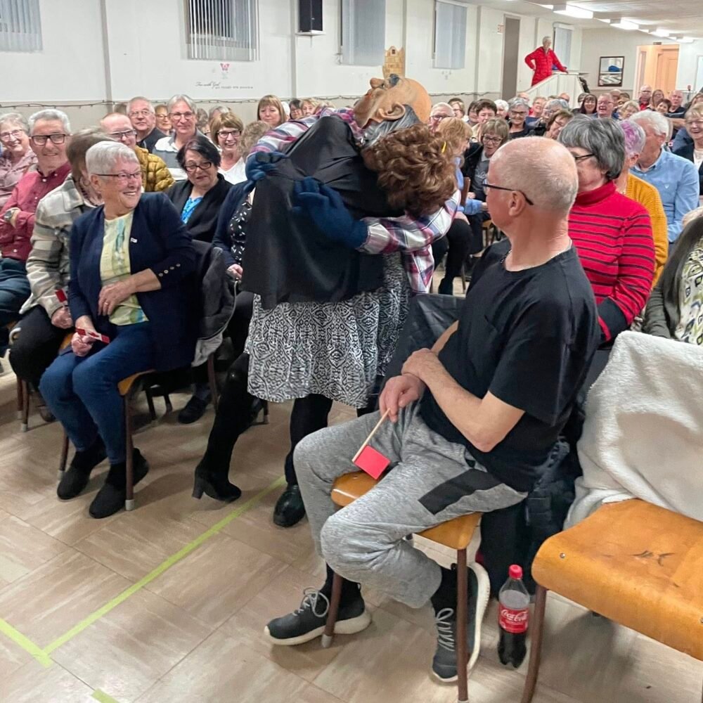 a hobby horse in the crowd at an old fashioned concert