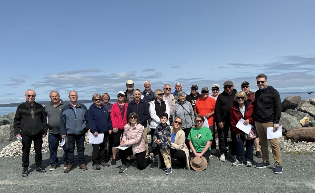 a large group of people on a dirt road or trail