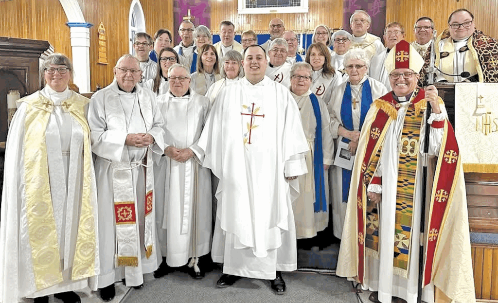 group of clergy at the front of a church immediately after an ordination