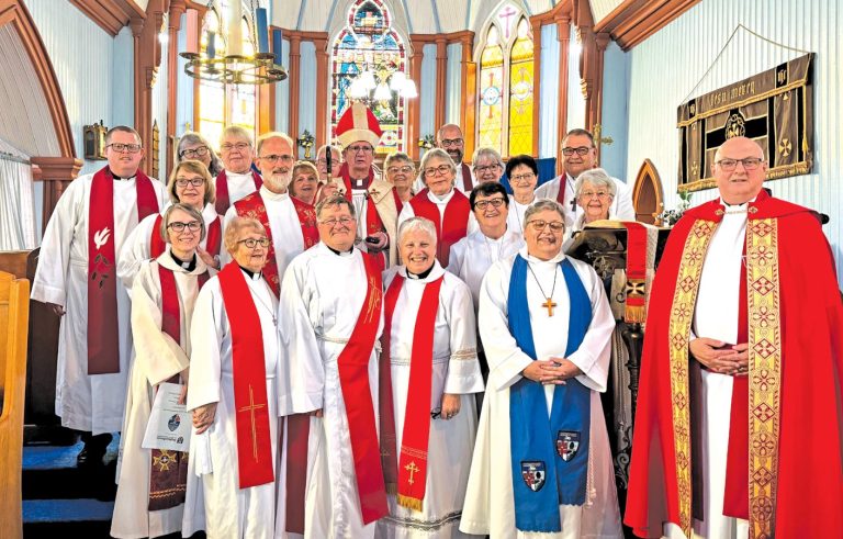 A group of Anglican clergy at the front of a church