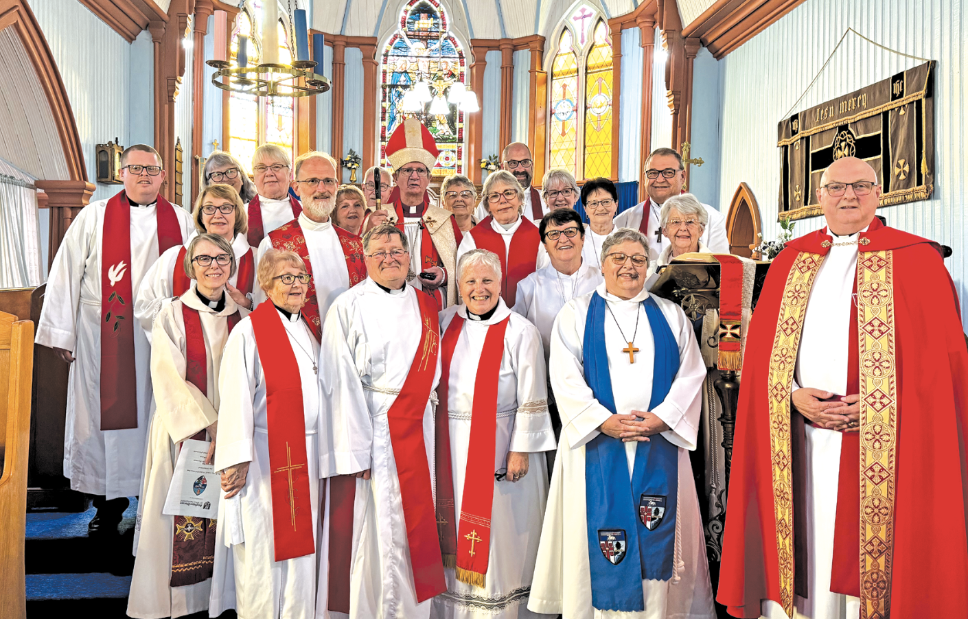 A group of Anglican clergy at the front of a church