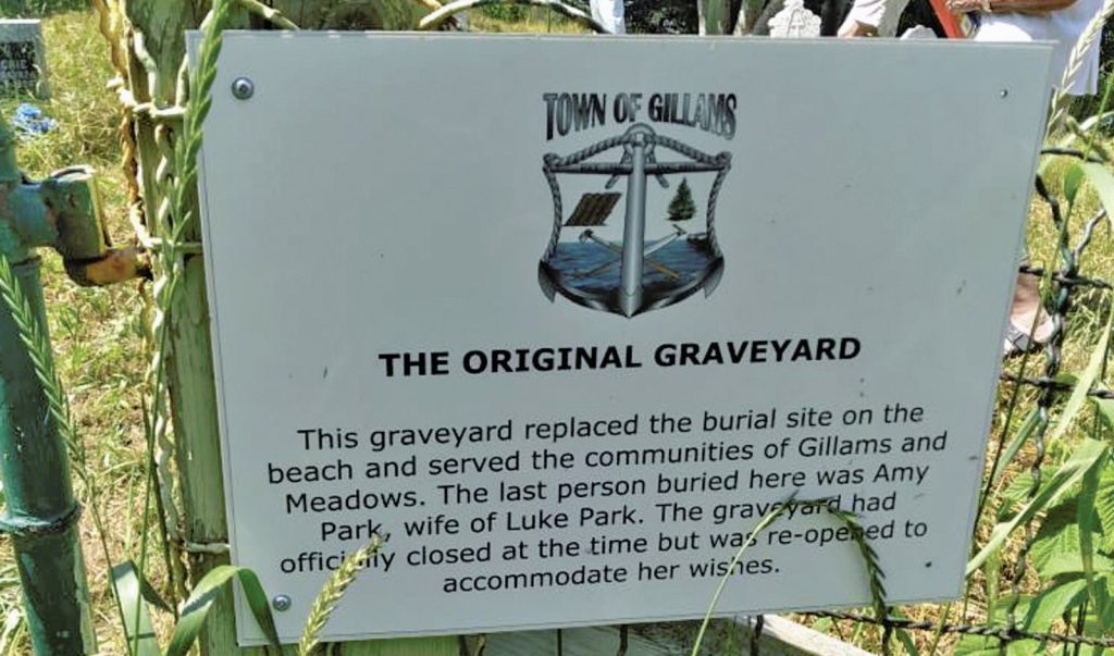 a sign talking about the original graveyard in Gillams Newfoundland