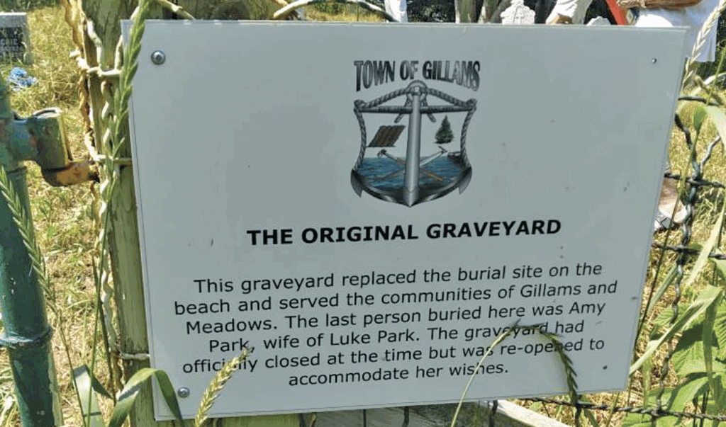 a sign talking about the original graveyard in Gillams Newfoundland