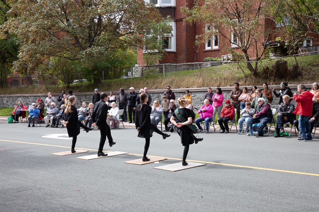 dancers performing on a street