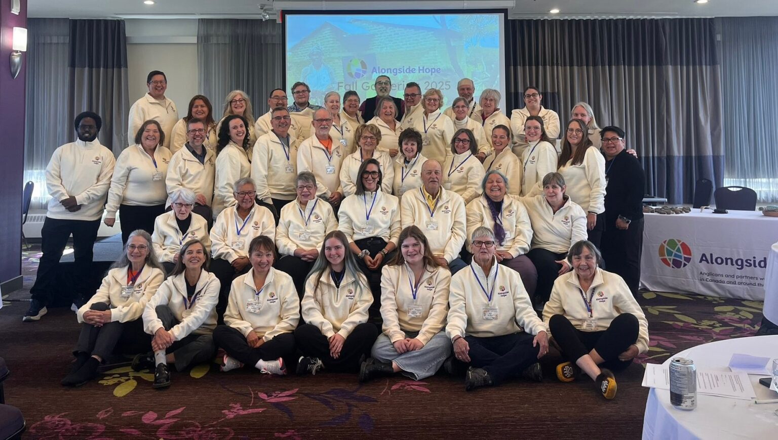 A group of people all wearing Alongside Hope shirts