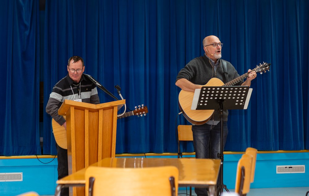 Each session began with signing. Here, Rev. Trevors is joined by participant Jimmy Strickland.