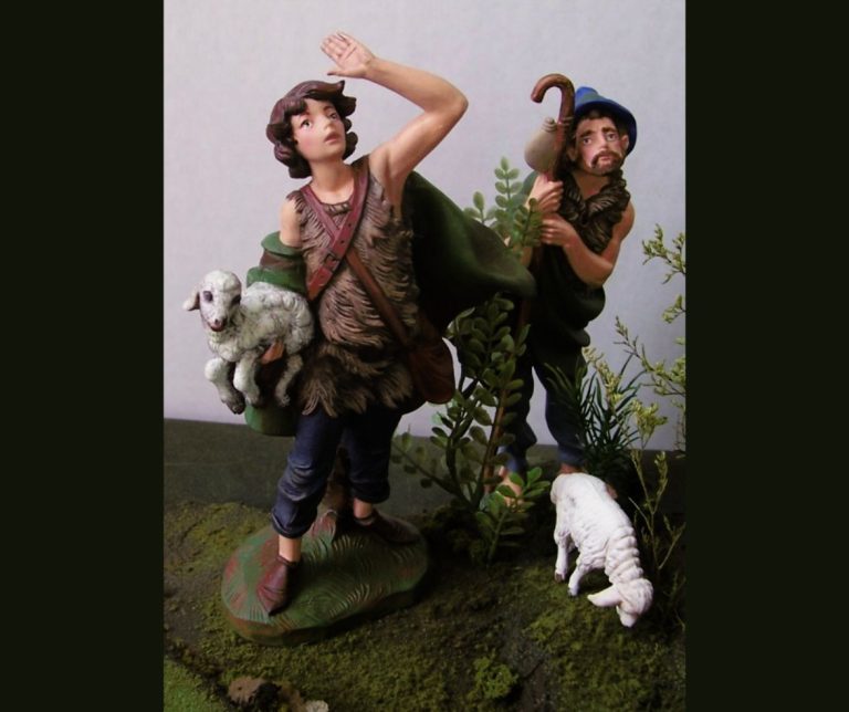 Two statues of shepherds from Biblical times, and one of a sheep