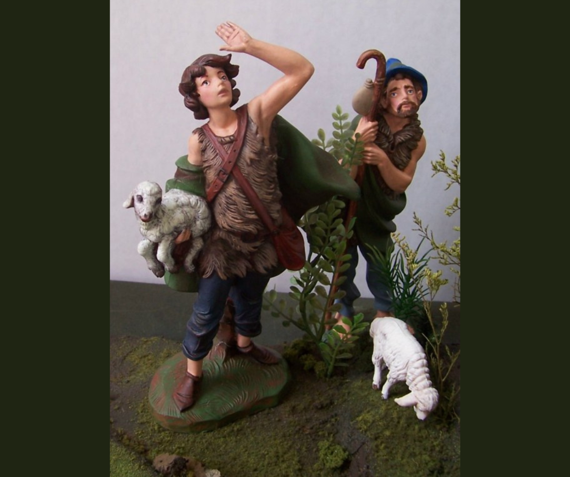 Two statues of shepherds from Biblical times, and one of a sheep